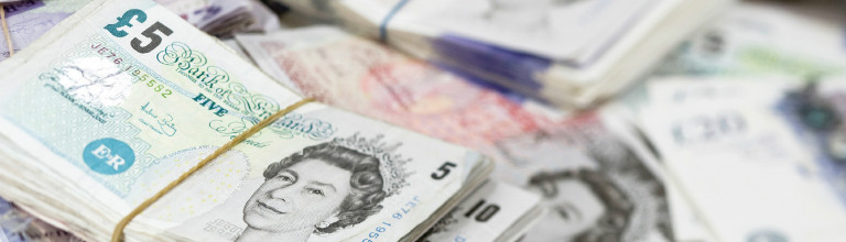 Bundles of UK currency