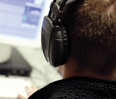 Rear shot of a man wearing headphones