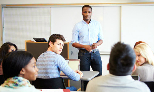 students and facilitator in a workshop on campus